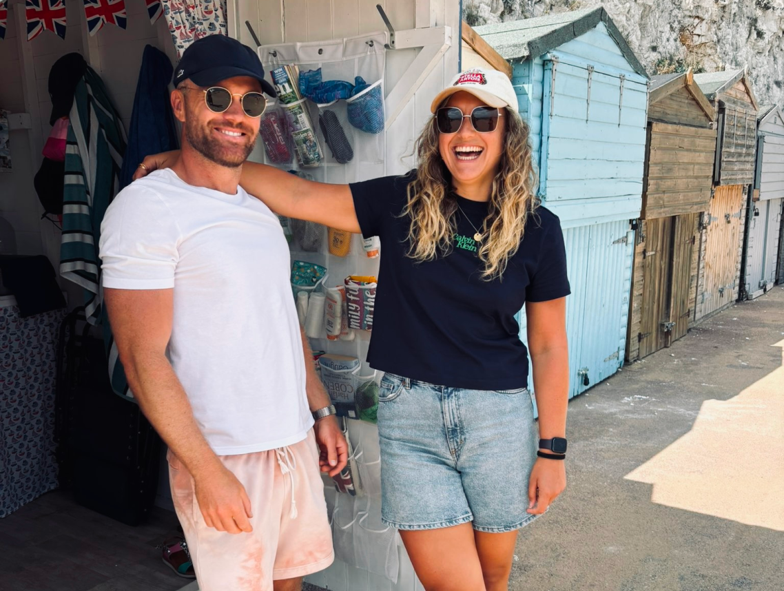 Postea co-founders David and Jacqui smiling together on the seafront in Ramsgate, Kent
